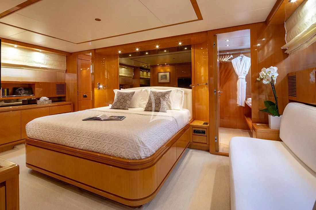 a large bed in a room aboard THE BIRD Yacht for Charter