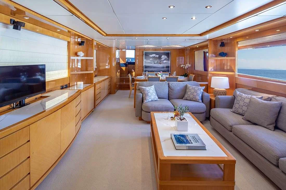 a living room with a couch and a coffee table aboard THE BIRD Yacht for Charter