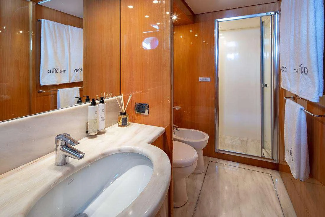 a bathroom with a sink and toilet aboard THE BIRD Yacht for Charter