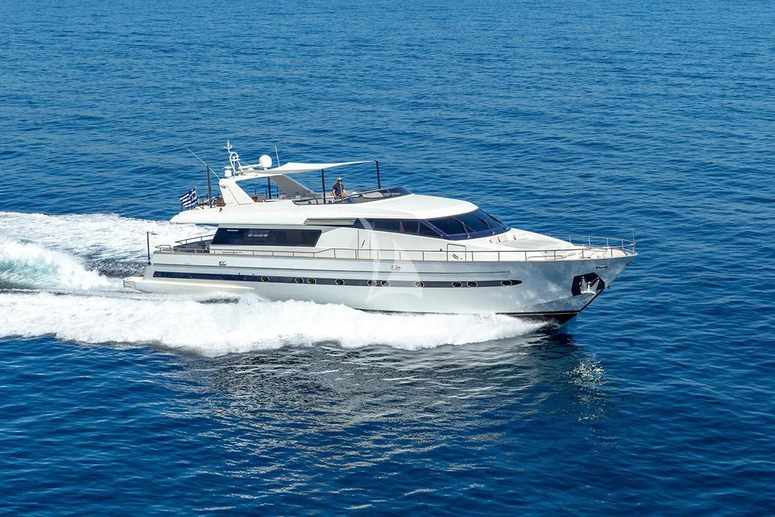 a white boat on the water aboard THE BIRD Yacht for Charter