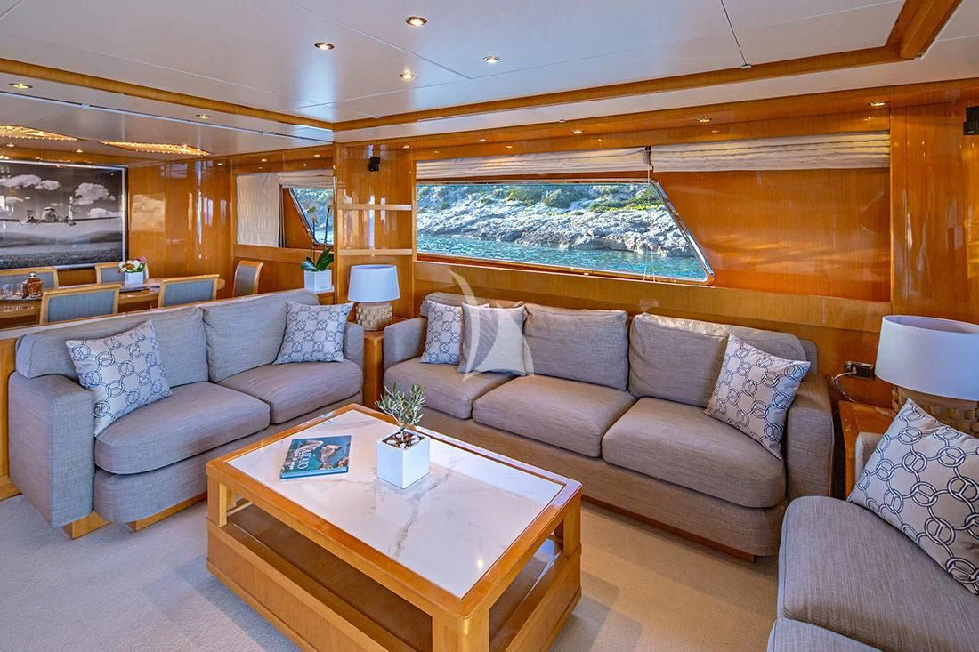 a living room with a large window aboard THE BIRD Yacht for Charter