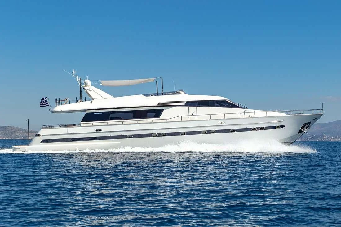 a white boat in the water aboard THE BIRD Yacht for Charter