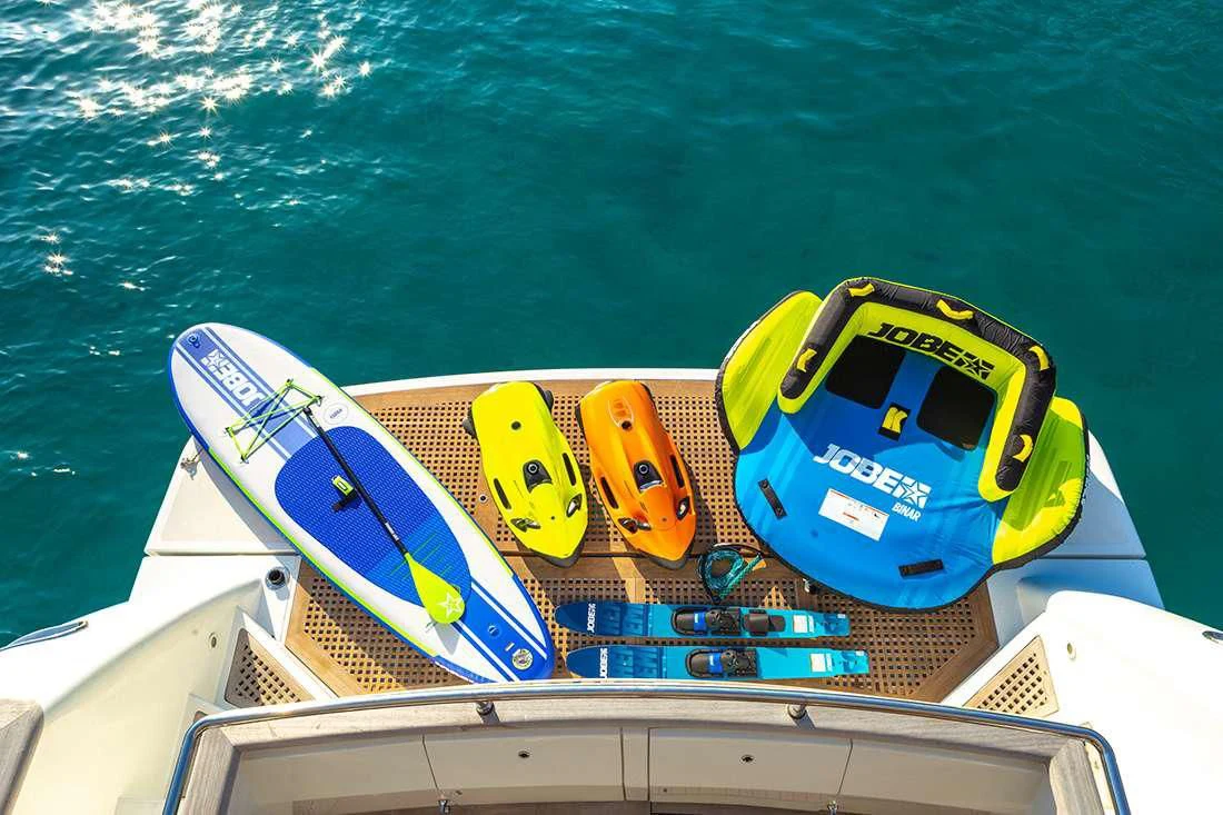 a yellow and blue boat on the water aboard THE BIRD Yacht for Charter