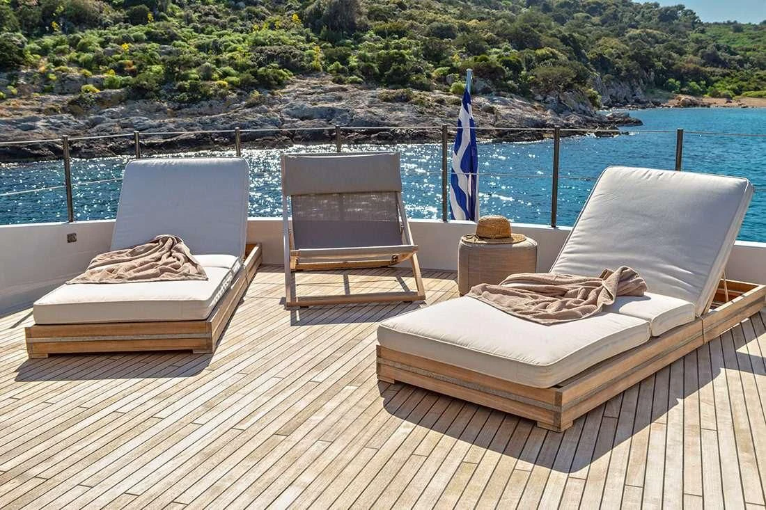 two chairs on a deck aboard THE BIRD Yacht for Charter