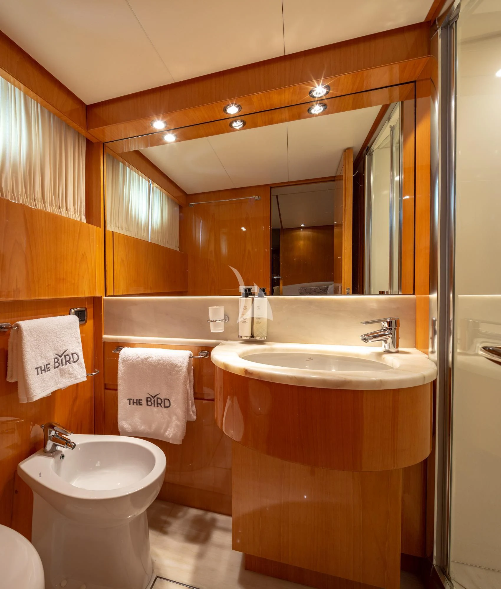 a bathroom with a sink and a mirror aboard THE BIRD Yacht for Charter