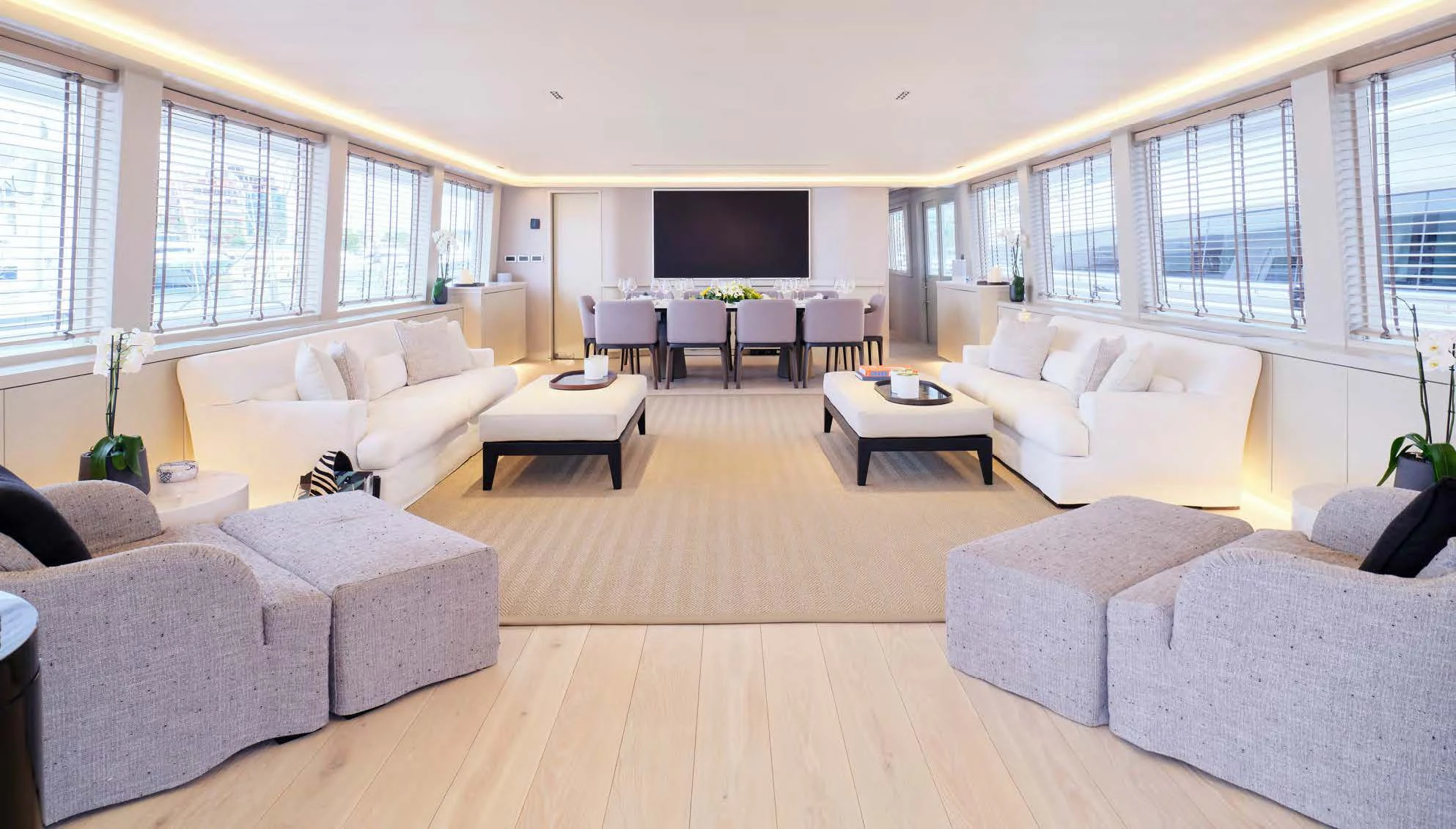 a living room with white furniture aboard ENDLESS SUMMER Yacht for Sale