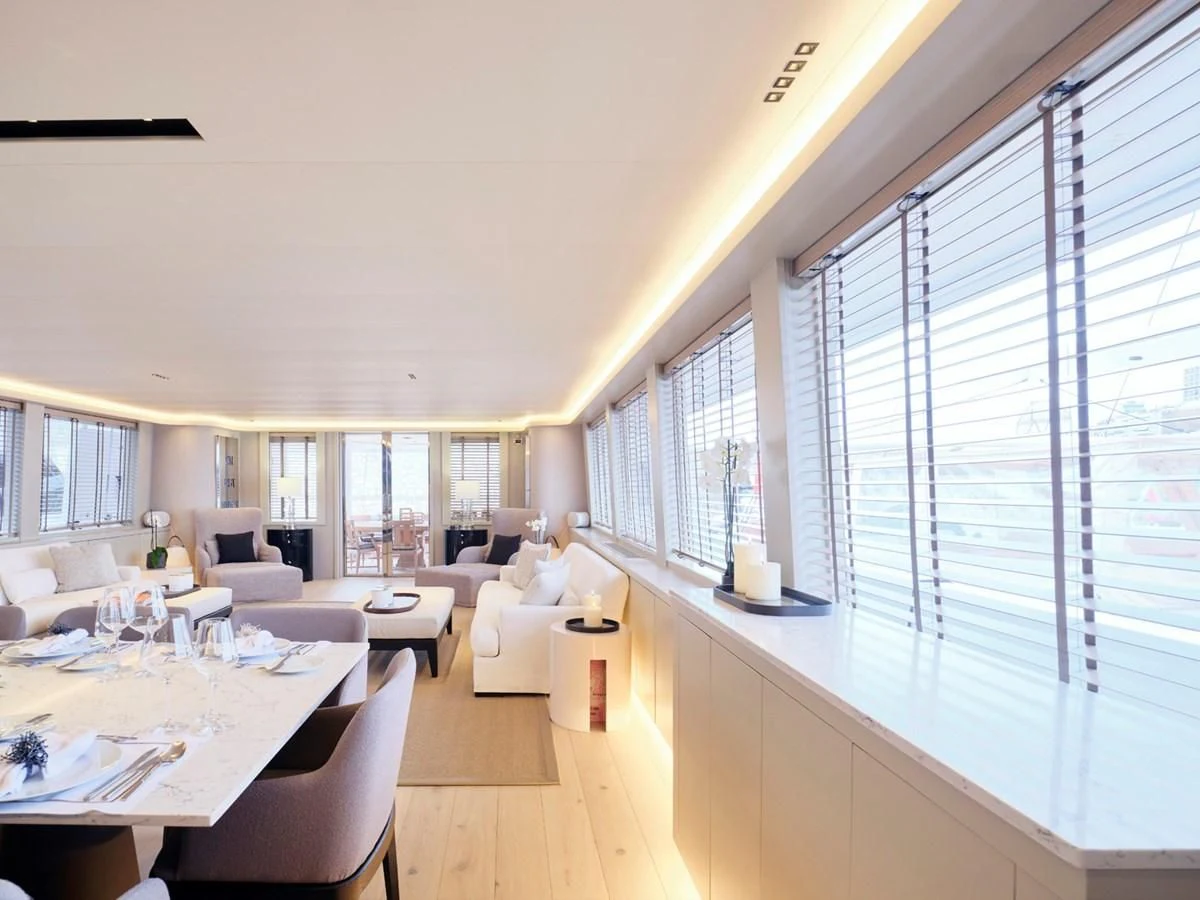 a living room with a large window aboard ENDLESS SUMMER Yacht for Sale