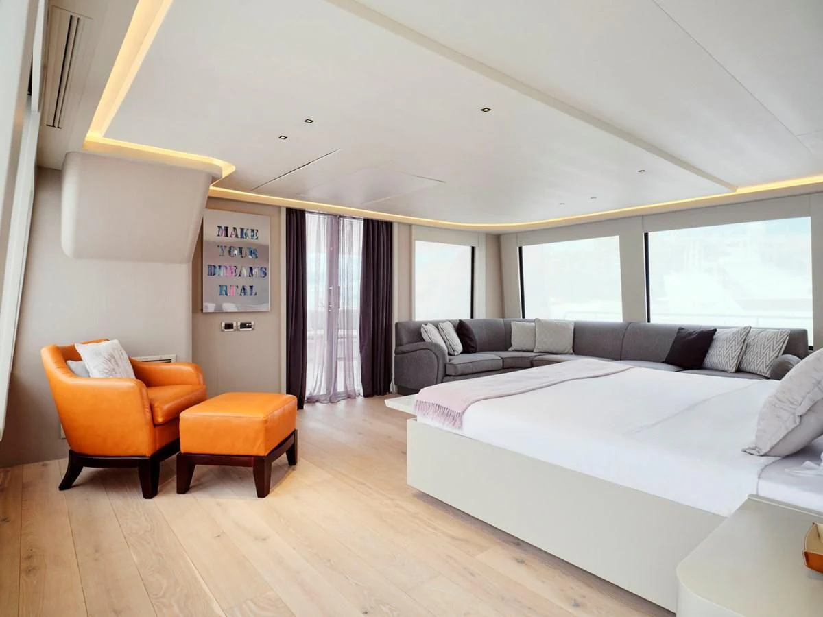 a living room with a bed and a couch aboard ENDLESS SUMMER Yacht for Sale