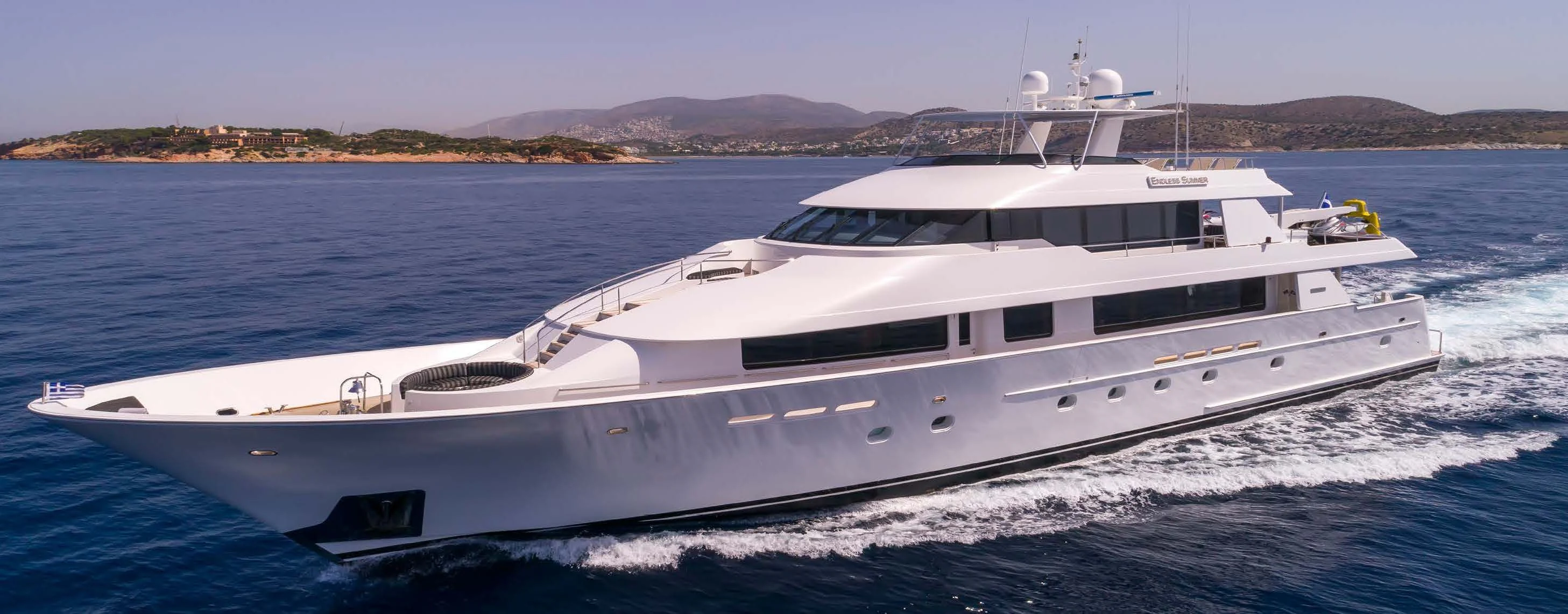a white yacht on the water aboard ENDLESS SUMMER Yacht for Sale