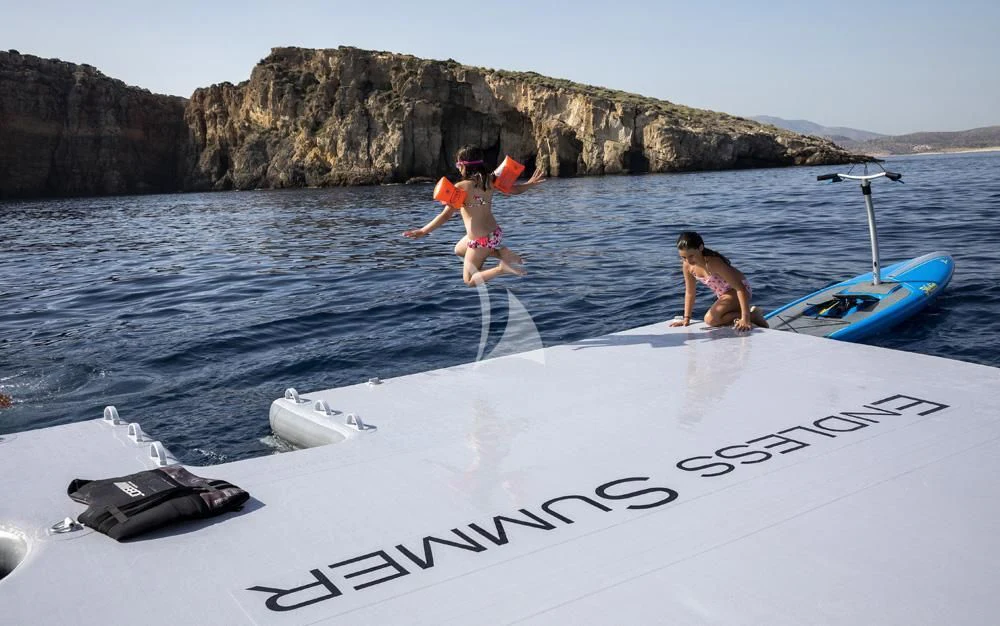 two people jumping into water aboard ENDLESS SUMMER Yacht for Sale