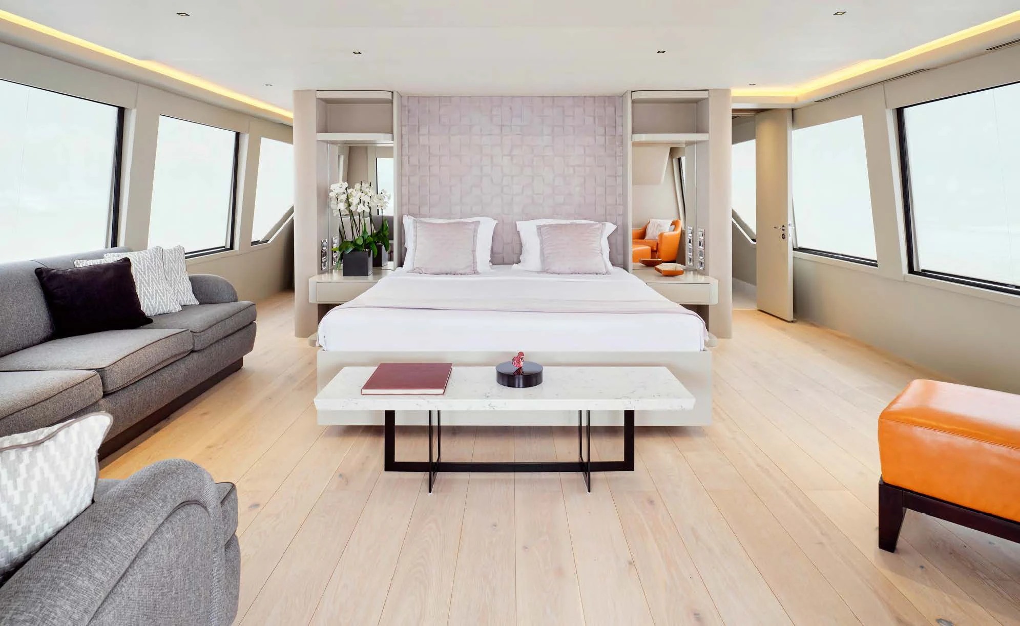 a large living room with a large white bed and a white table aboard ENDLESS SUMMER Yacht for Sale