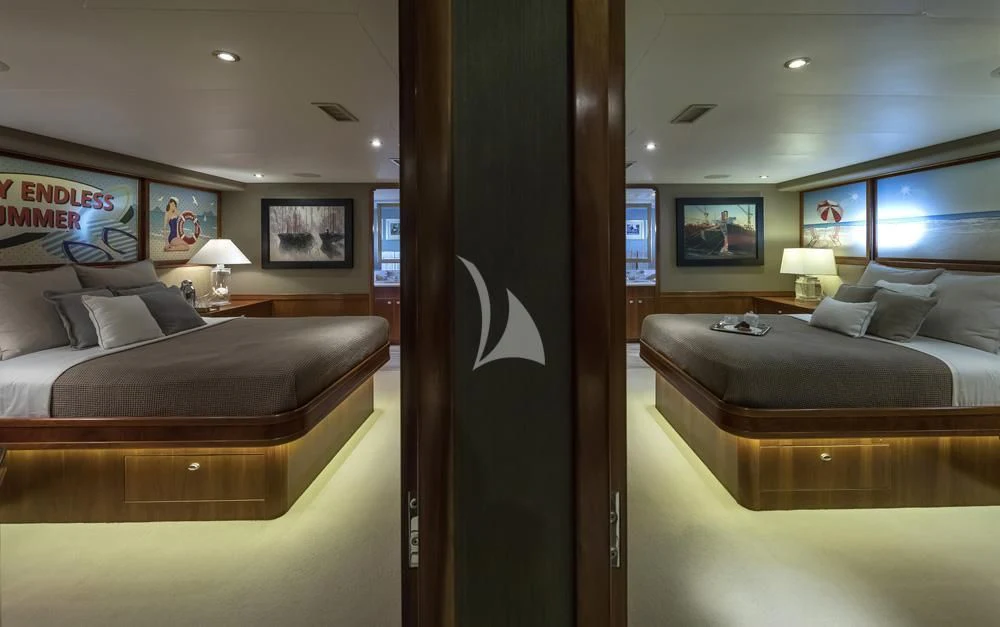 a room with a bed and a couch aboard ENDLESS SUMMER Yacht for Sale