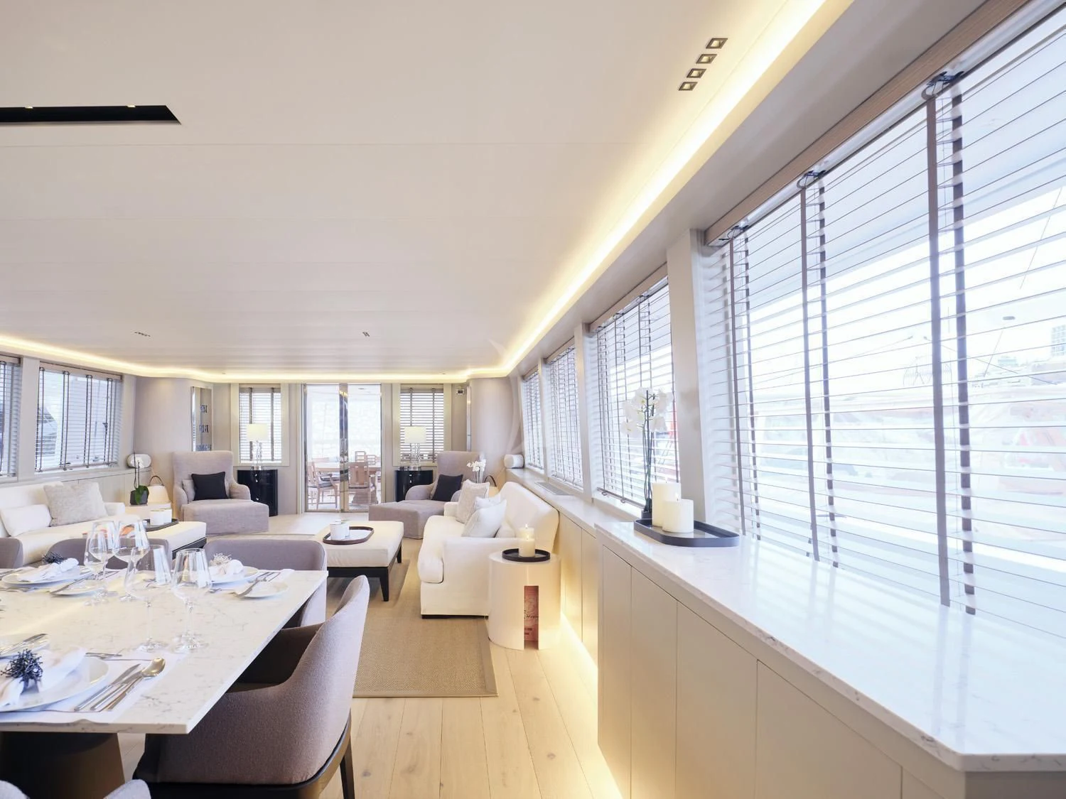 a large living room with a large window aboard ENDLESS SUMMER Yacht for Sale