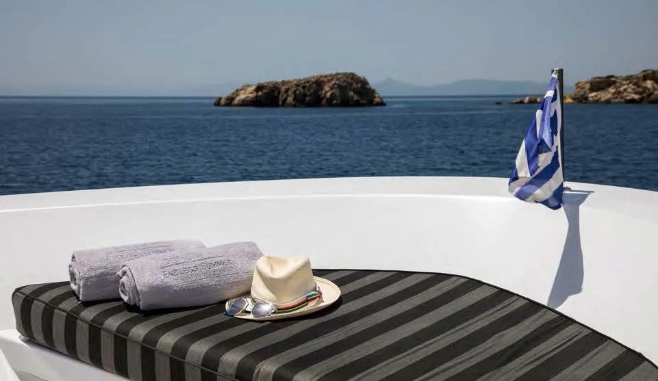 a boat with a hat and a towel on it aboard ENDLESS SUMMER Yacht for Sale