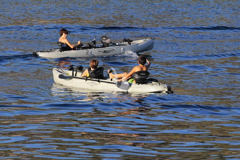 a group of people in a rowboat on the water aboard ENDLESS SUMMER Yacht for Sale