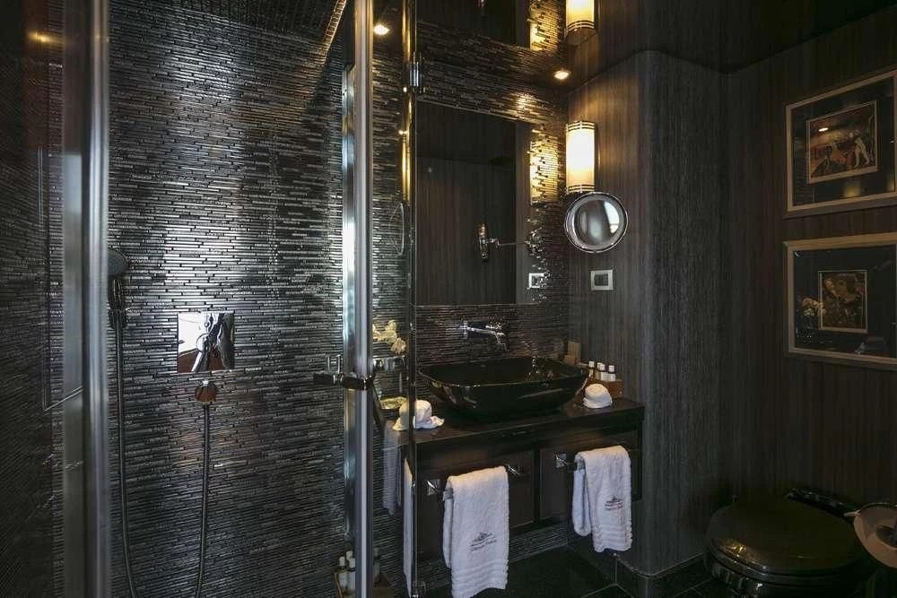 a bathroom with a sink and mirror aboard ENDLESS SUMMER Yacht for Sale