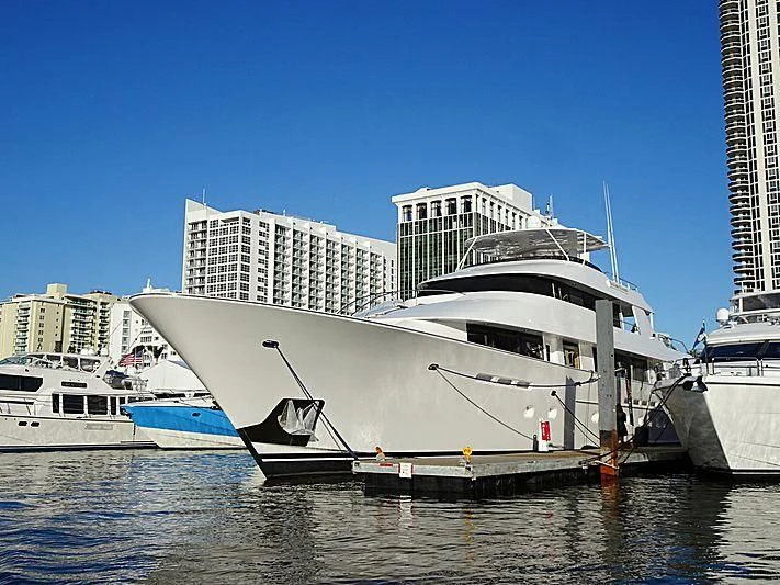 a large white boat in a harbor aboard ENDLESS SUMMER Yacht for Sale
