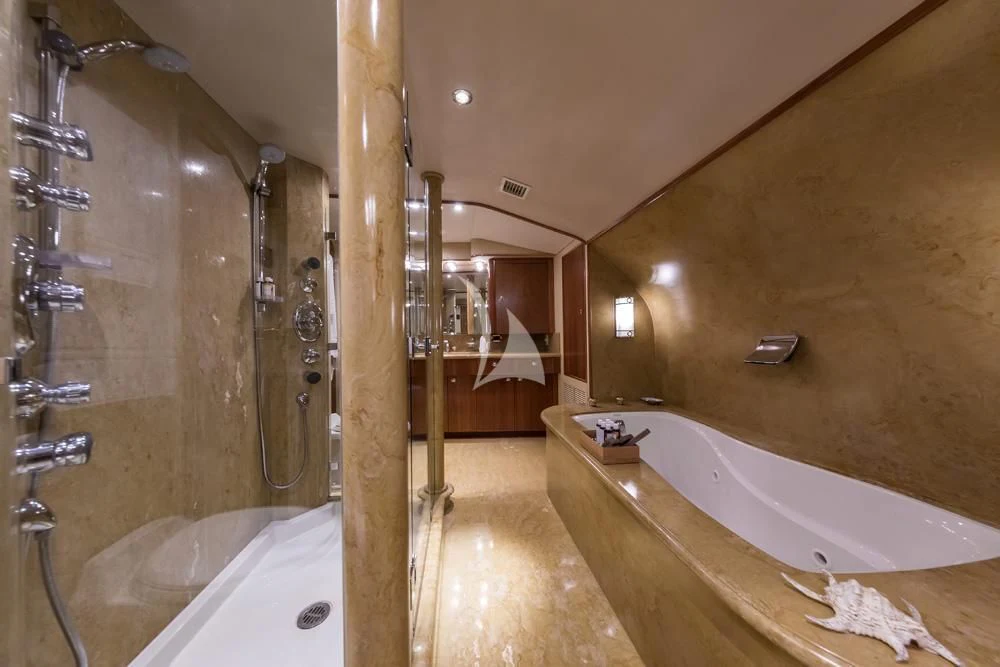 a bathroom with a tub and shower aboard ENDLESS SUMMER Yacht for Sale