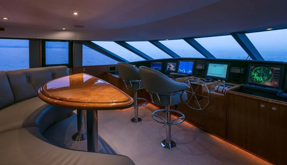 a room with a table and chairs aboard ENDLESS SUMMER Yacht for Sale