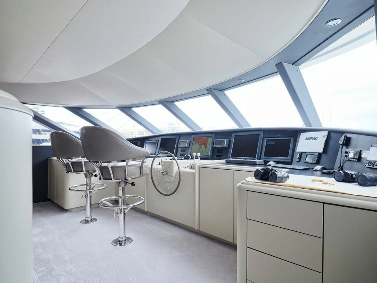 a room with a desk and chairs aboard ENDLESS SUMMER Yacht for Sale