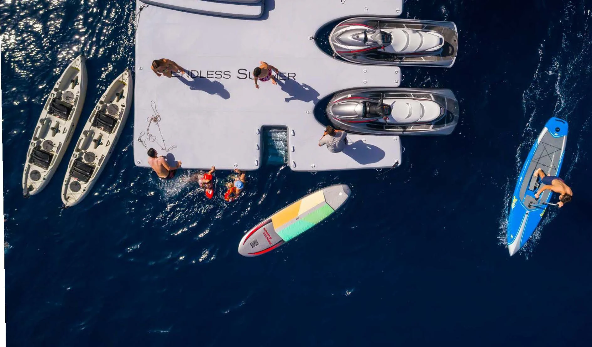 a group of people swimming in water aboard ENDLESS SUMMER Yacht for Sale