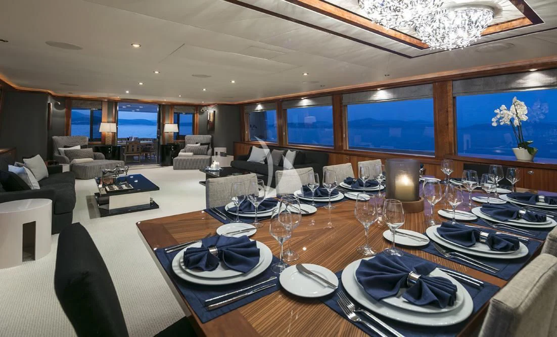 a large dining room with a large screen aboard ENDLESS SUMMER Yacht for Sale