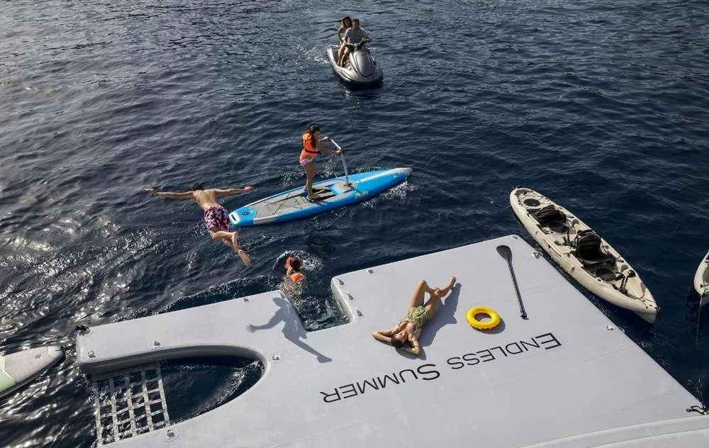 a group of people on a boat aboard ENDLESS SUMMER Yacht for Sale