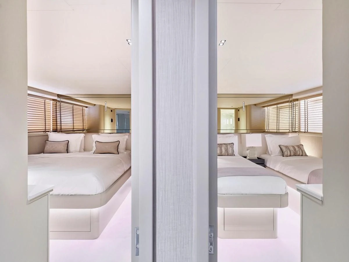 a room with a bed and a window aboard ENDLESS SUMMER Yacht for Sale