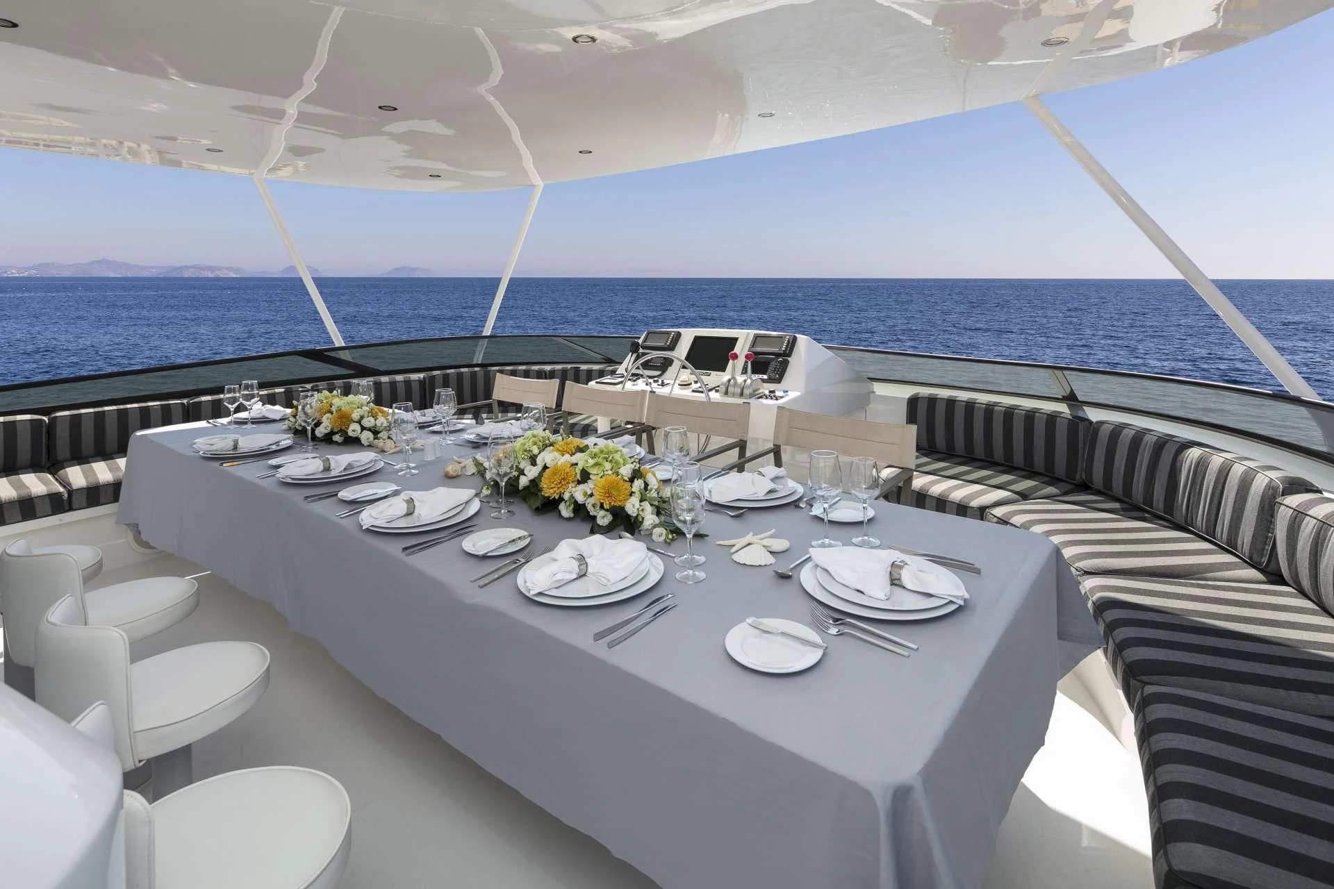 a table set for a dinner on a boat aboard ENDLESS SUMMER Yacht for Sale
