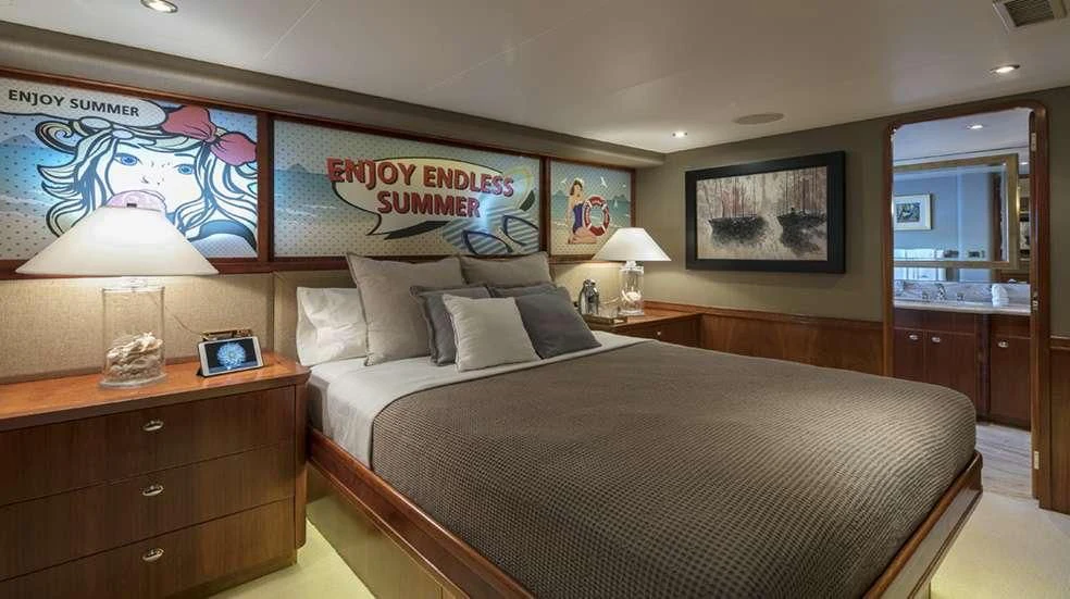 a bedroom with a large bed aboard ENDLESS SUMMER Yacht for Sale