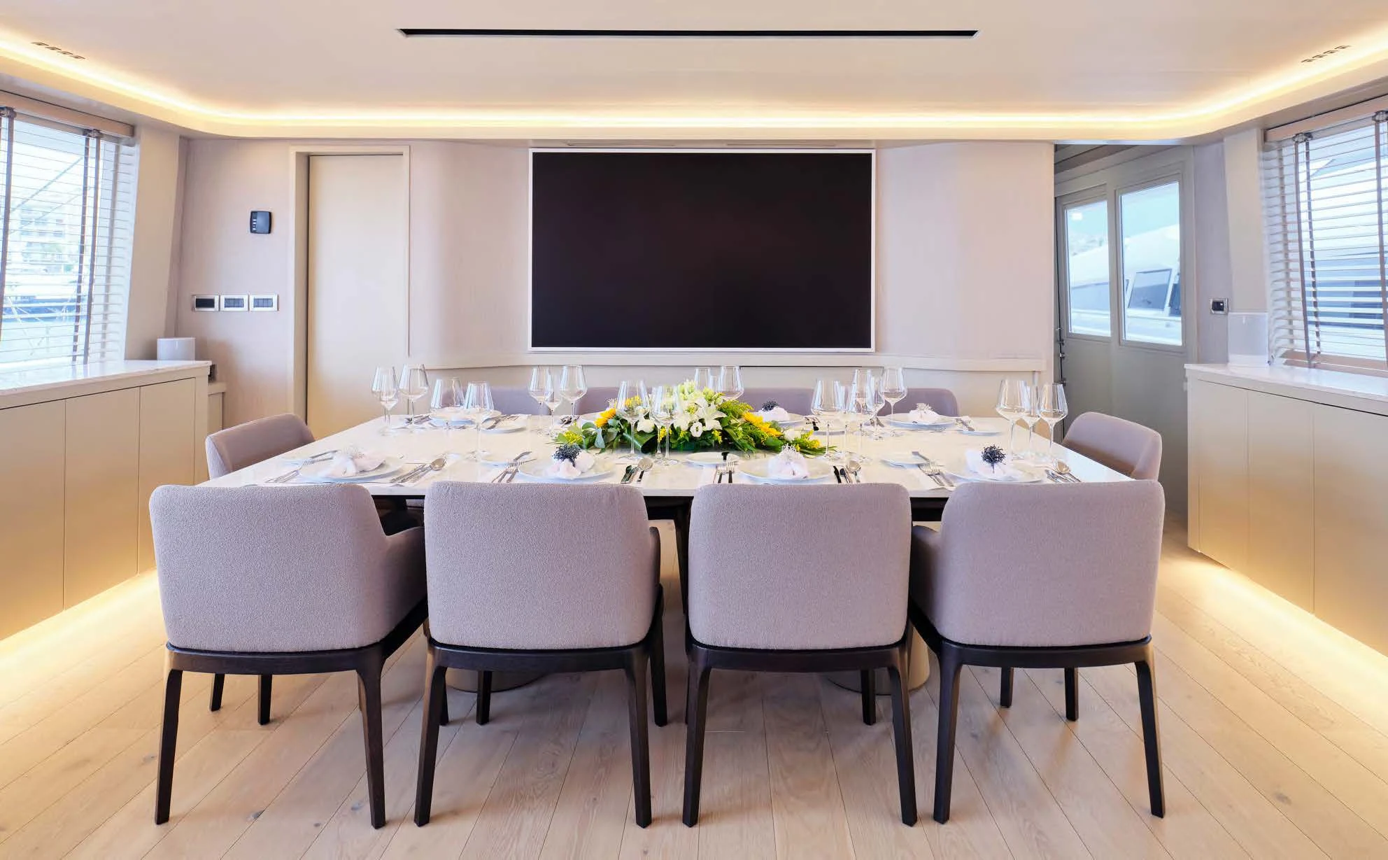 a large room with a table and chairs aboard ENDLESS SUMMER Yacht for Sale