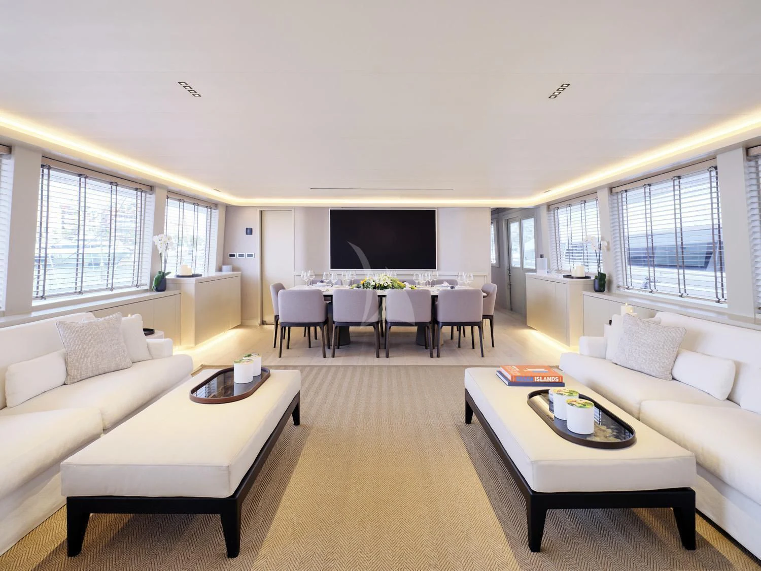 a living room with white furniture aboard ENDLESS SUMMER Yacht for Sale
