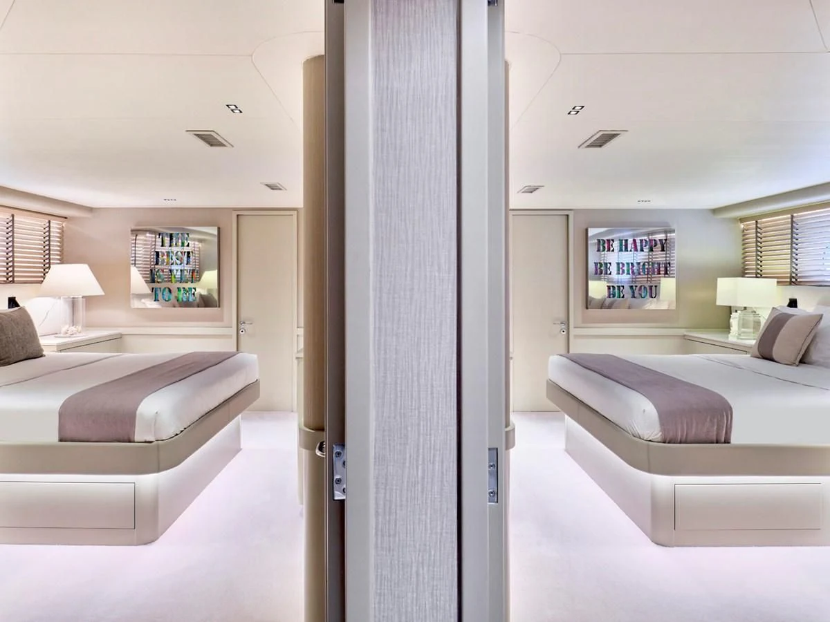 a room with a bed and a couch aboard ENDLESS SUMMER Yacht for Sale