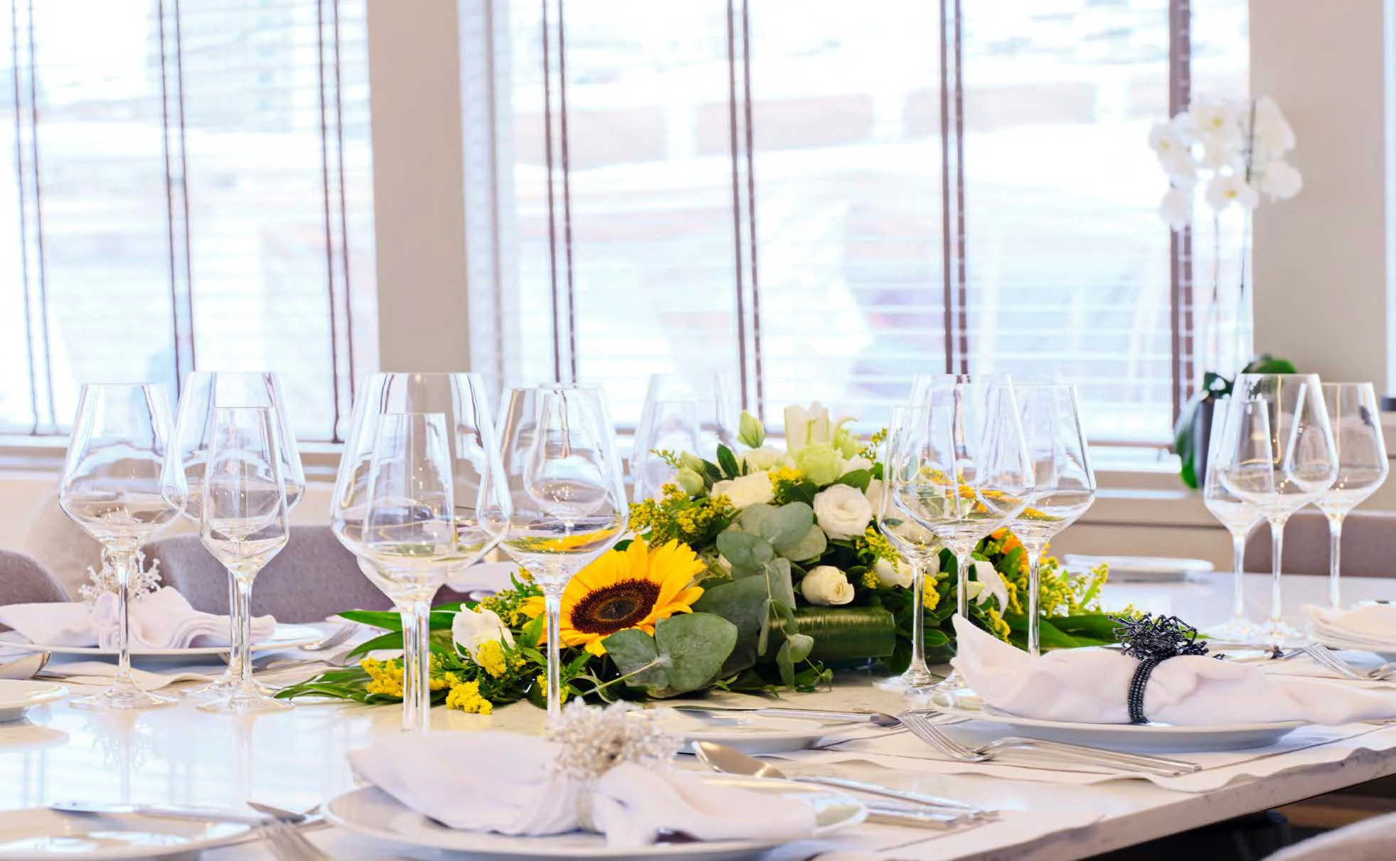 a table set with wine glasses aboard ENDLESS SUMMER Yacht for Sale