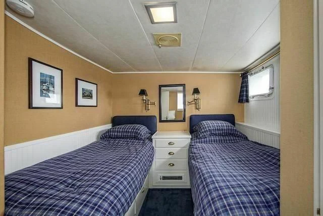 a couple of beds in a small room aboard LADY FAYE Yacht for Sale