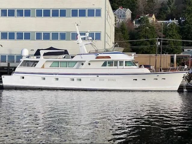 a white boat on the water aboard LADY FAYE Yacht for Sale