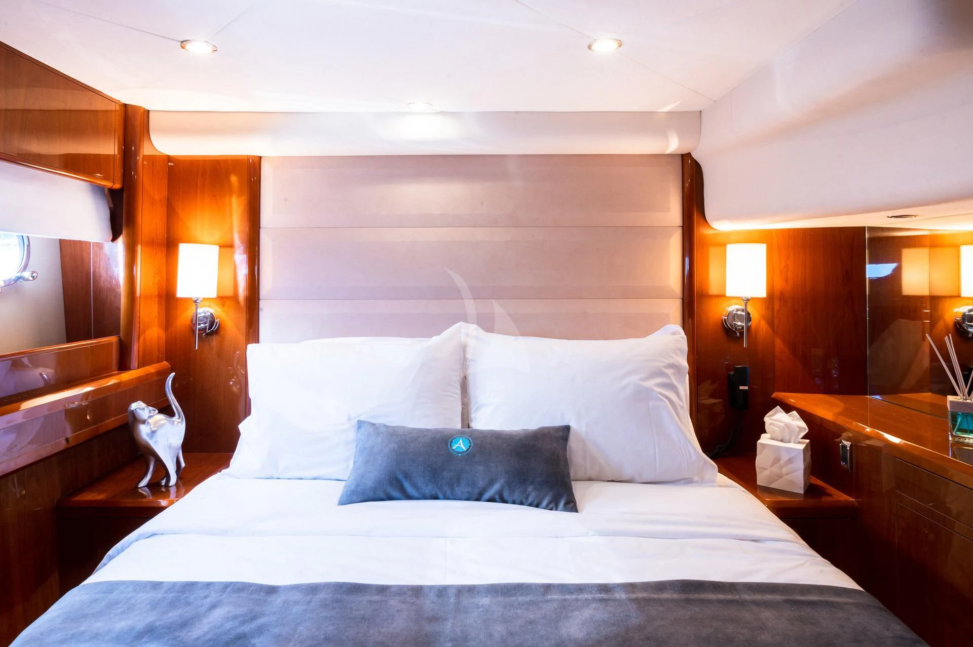 a bed with white sheets and pillows aboard AZURE Yacht for Sale