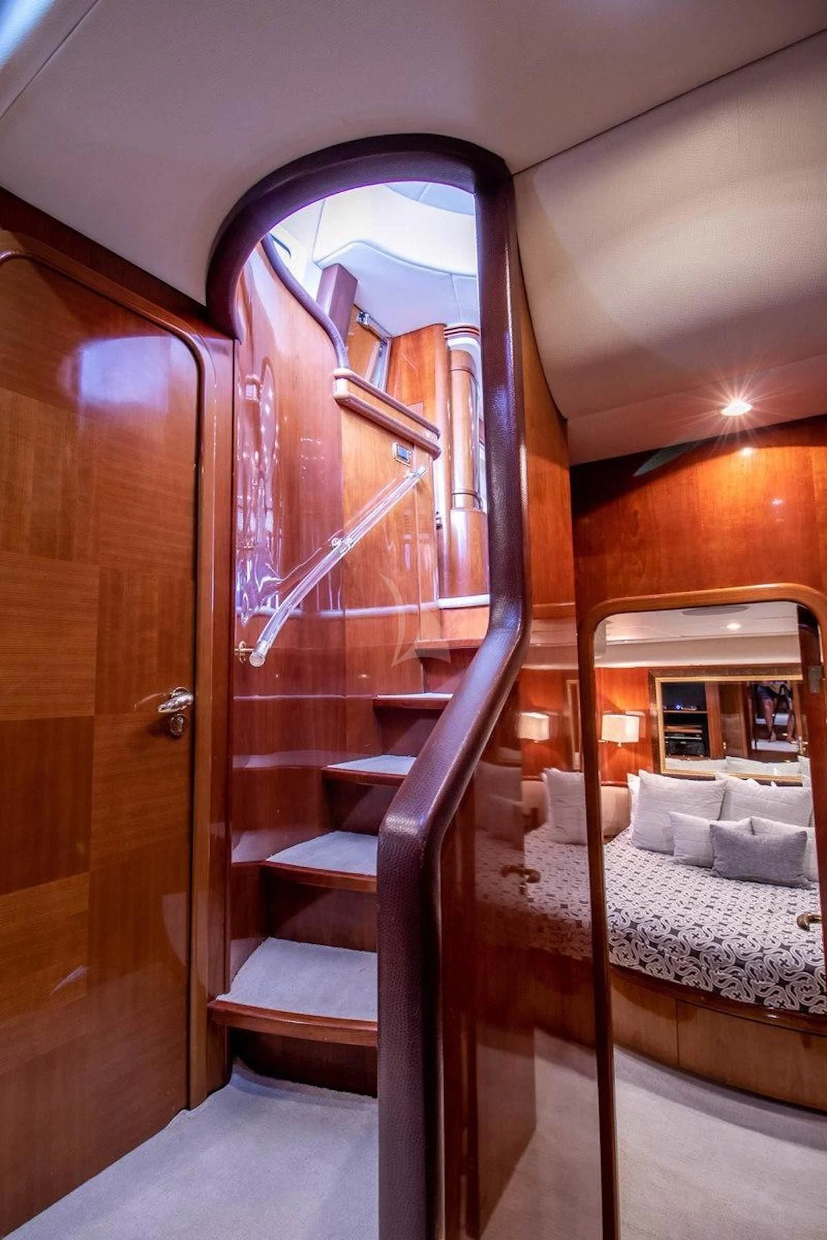 a bed and a mirror in a room aboard AZURE Yacht for Sale