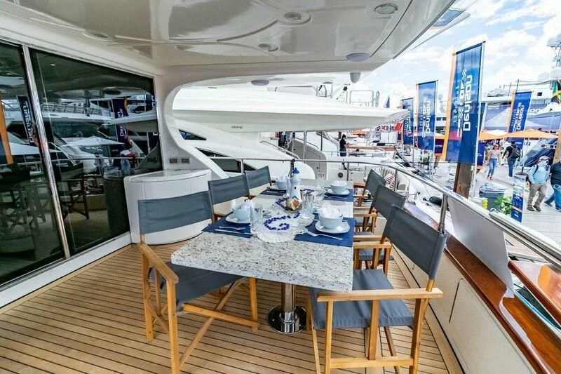 a room with a table and chairs aboard AZURE Yacht for Sale