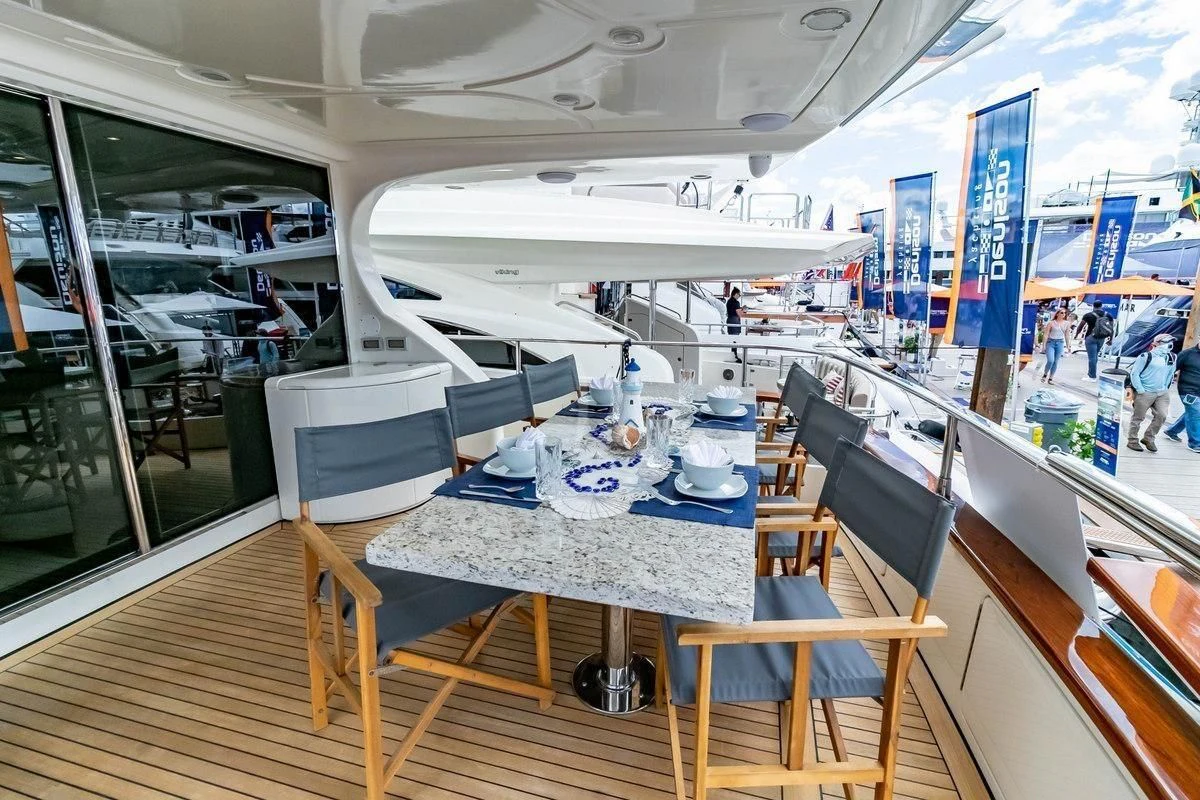 a room with a table and chairs aboard AZURE Yacht for Sale