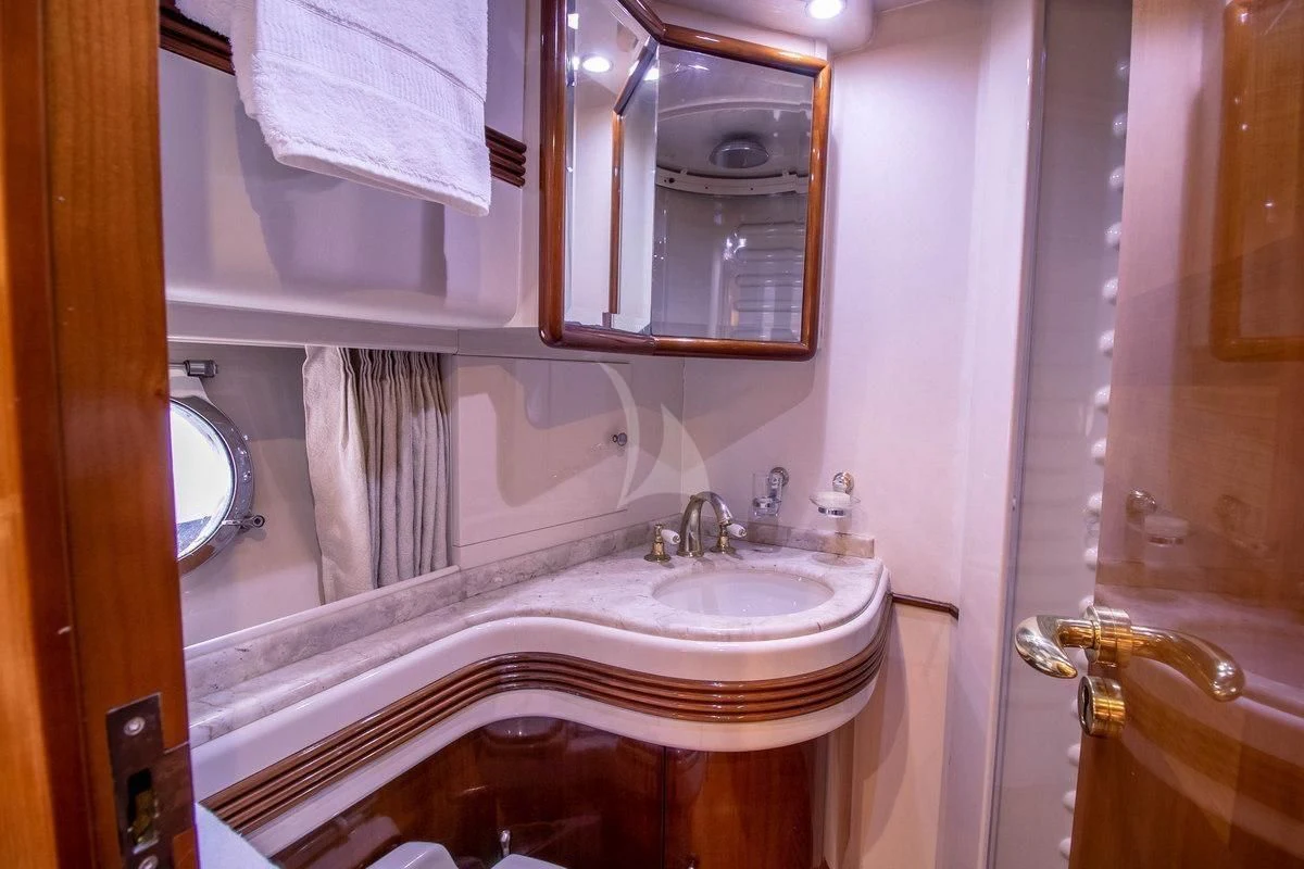 a bathroom with a sink and a mirror aboard AZURE Yacht for Sale