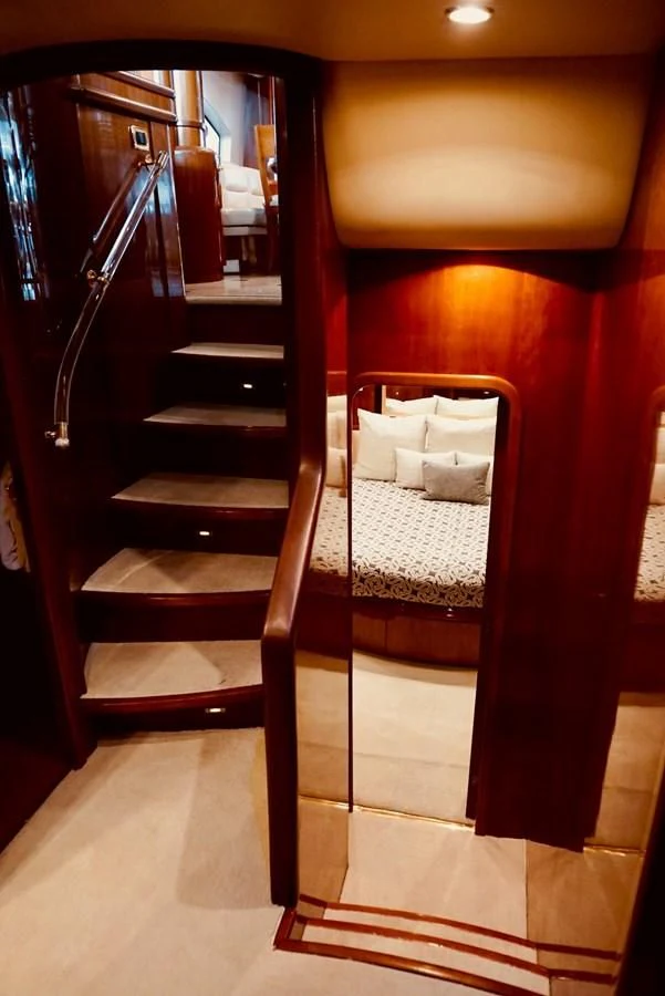 a bed and a ladder in a room aboard AZURE Yacht for Sale