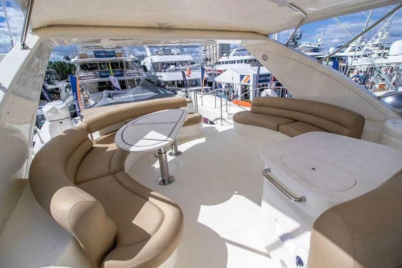 a room with a table chairs and a large window aboard AZURE Yacht for Sale