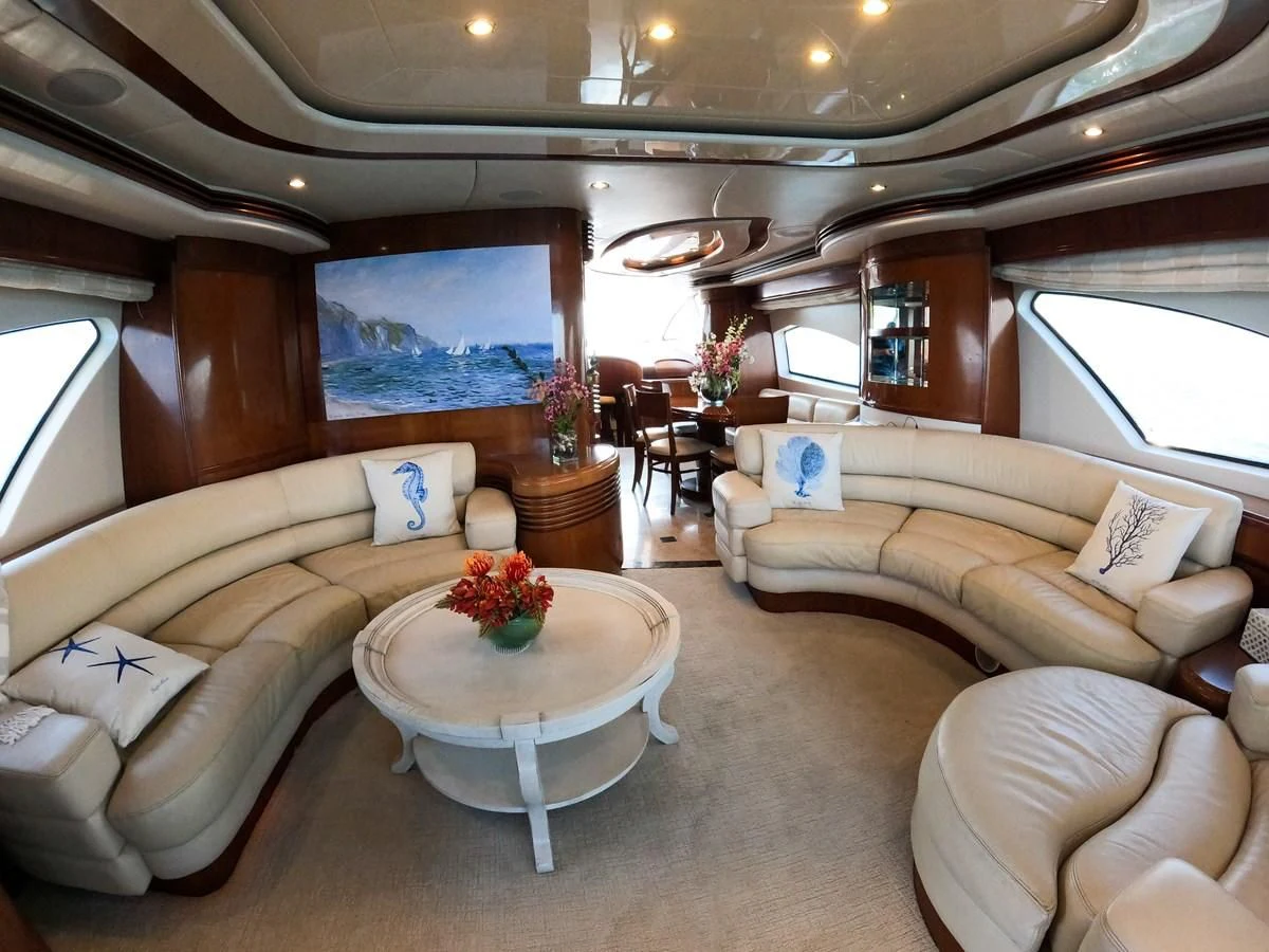 a living room with a table and couches aboard AZURE Yacht for Sale