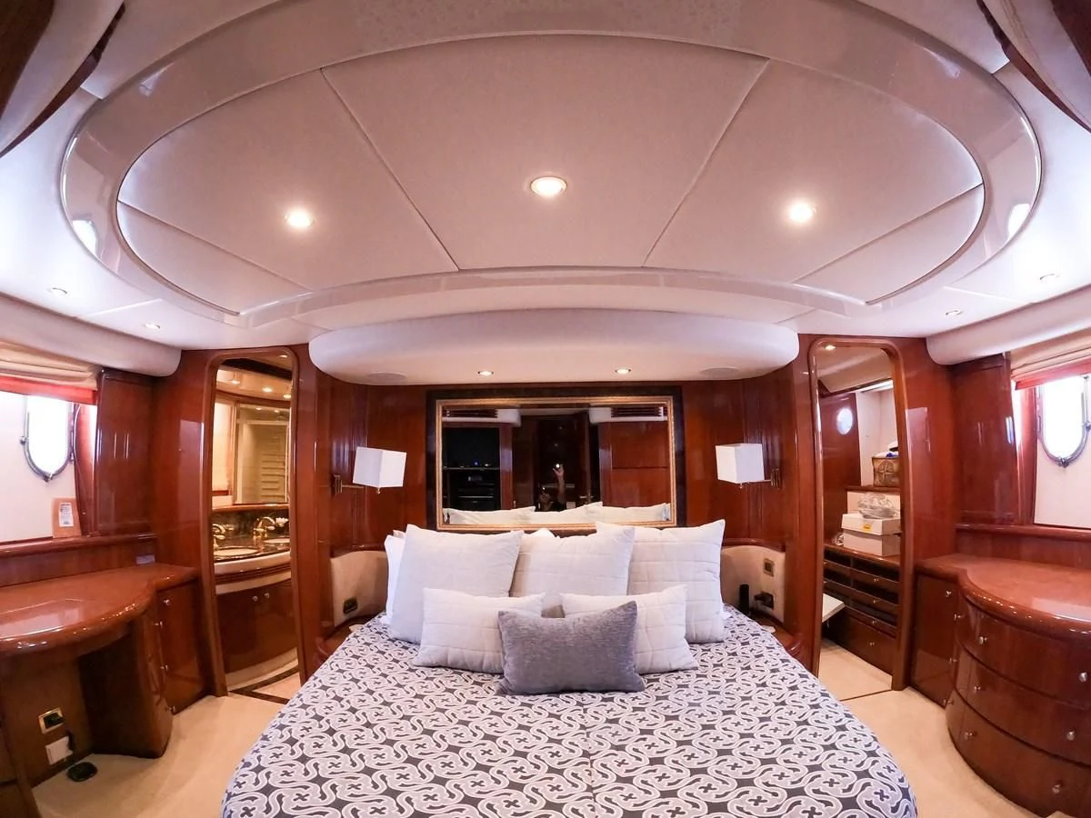a large hotel room with a large bed and a large mirror aboard AZURE Yacht for Sale