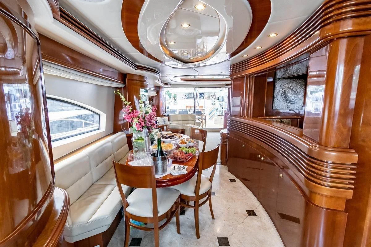 a dining room with a table aboard AZURE Yacht for Sale