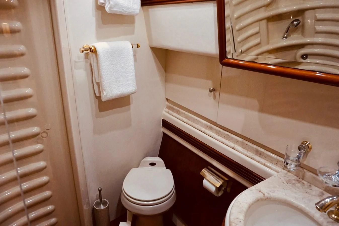 a bathroom with a toilet and sink aboard AZURE Yacht for Sale