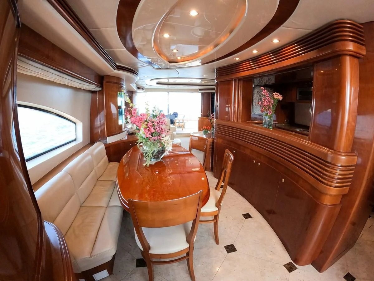 a dining room with a table and chairs aboard AZURE Yacht for Sale