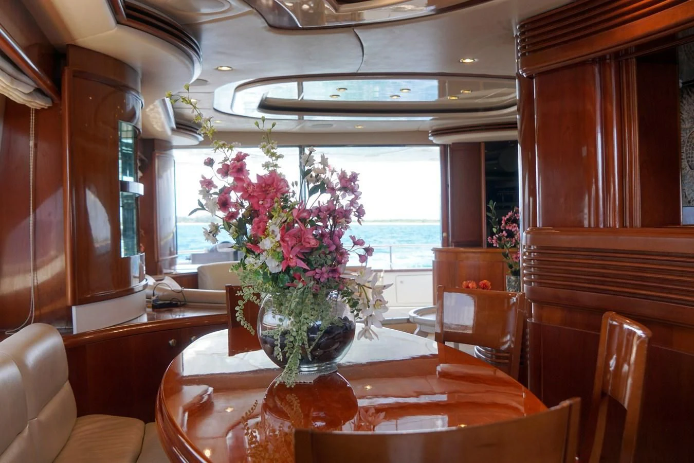 a vase of flowers on a table aboard AZURE Yacht for Sale