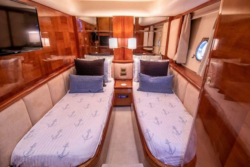 a room with beds and a window aboard AZURE Yacht for Sale
